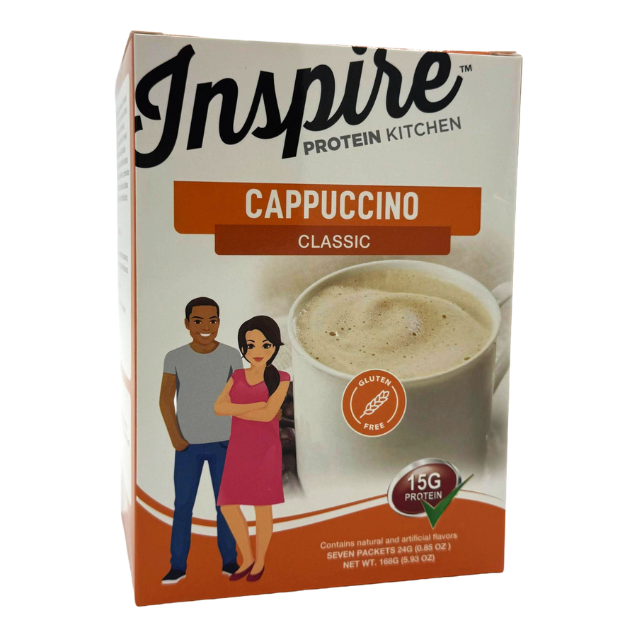A box of Inspire Protein Kitchen Classic Cappuccino featuring a cup of cappuccino and illustrations of a man and a woman smiling, highlighting that the product is gluten-free and contains 15g of protein.