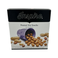 A purple cup spills peanut soy snacks onto a white surface, with whole peanuts scattered around, showcasing the product titled "Peanut Soy Snacks" by Inspire.