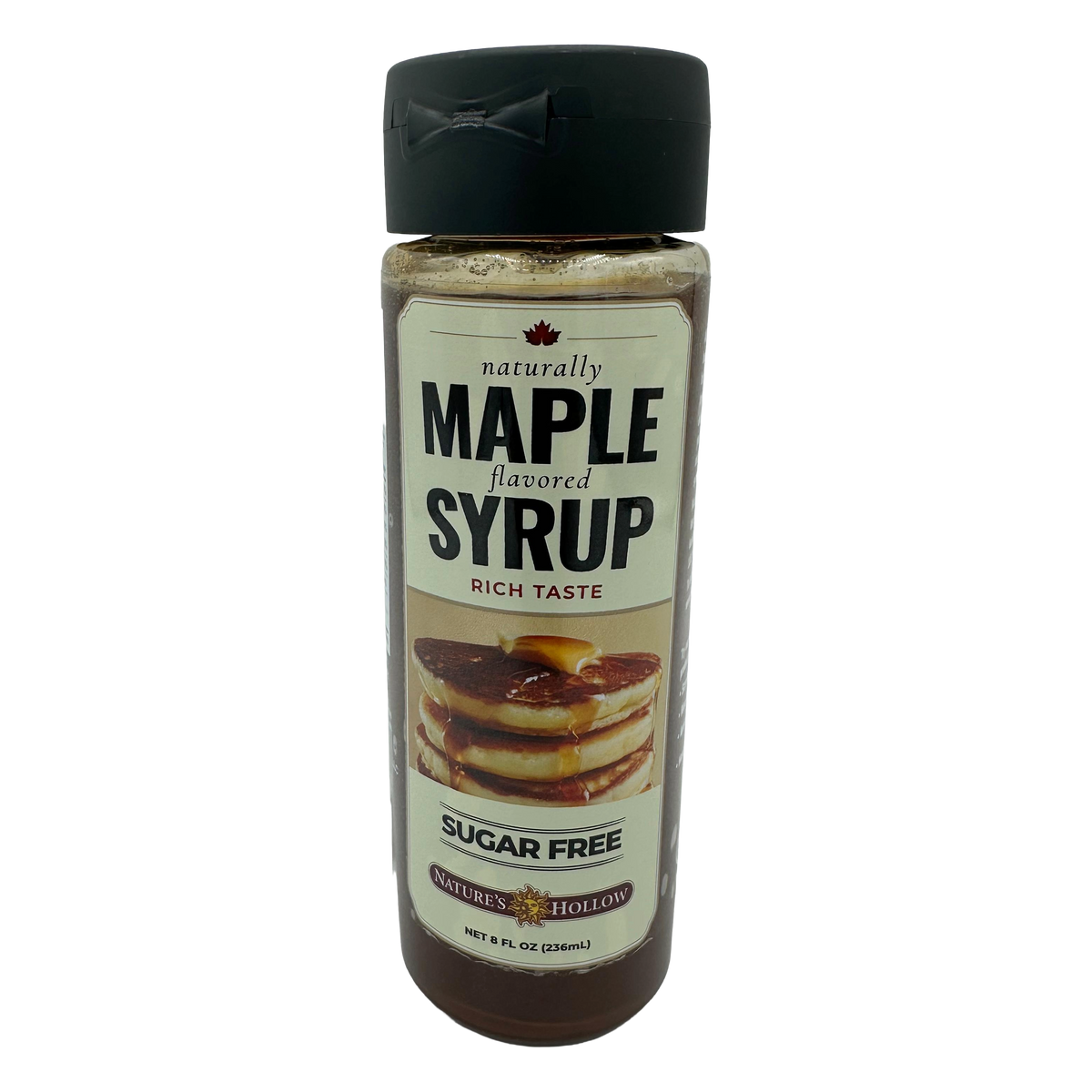 A clear bottle of sugar-free maple syrup features a label with bold text stating "naturally MAPLE flavored" and an image of pancakes drizzled with syrup, indicating its rich taste.