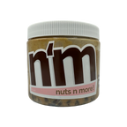 A clear jar of nut butter labeled "n'm" with a brown logo and pink accents, showcasing the product name "nuts n more!" against a black background.