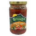 A clear glass jar of Green Mountain Gringo roasted garlic medium salsa, featuring a colorful label with images of vegetables, sits against a plain background.