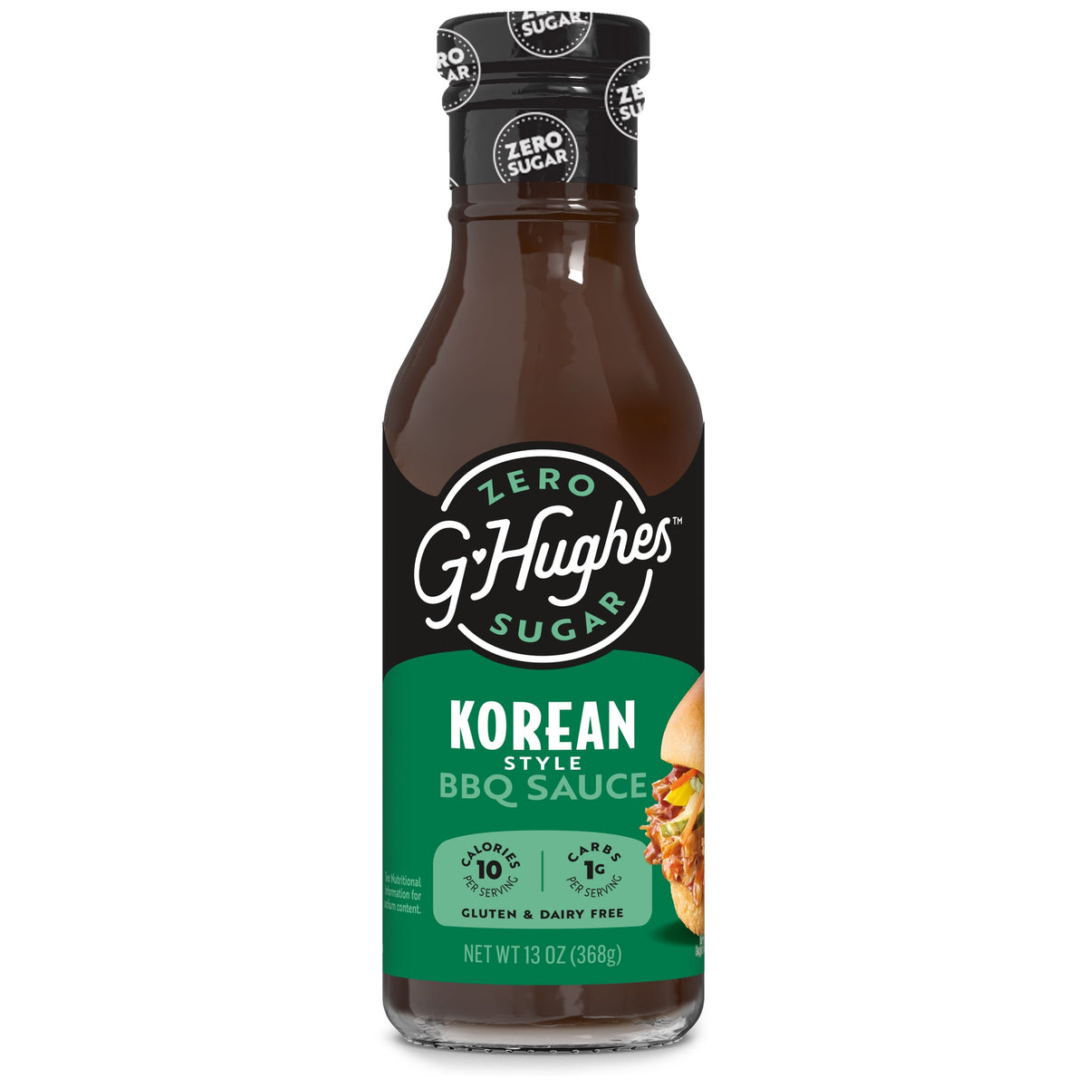 A bottle of G. Hughes Korean Style BBQ Sauce, labeled as zero sugar, gluten-free, and dairy-free, features a dark brown sauce with a green and black design, highlighting its nutritional information.