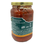 A clear glass jar filled with a chunky red salsa, featuring a gold lid, displays ingredient details and nutrition facts on the back label, emphasizing its fresh vegetable contents.