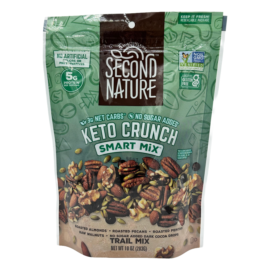 A resealable bag of Second Nature Keto Crunch Smart Mix, featuring a blend of roasted almonds, pecans, walnuts, and pepitas, with labels highlighting low net carbs and no added sugar.