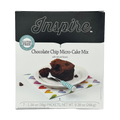 A box of Inspire Chocolate Chip Micro-Cake Mix features a slice of cake on a white plate with a fork, set on a colorful heart-patterned napkin, highlighting its gluten-free and natural flavors.