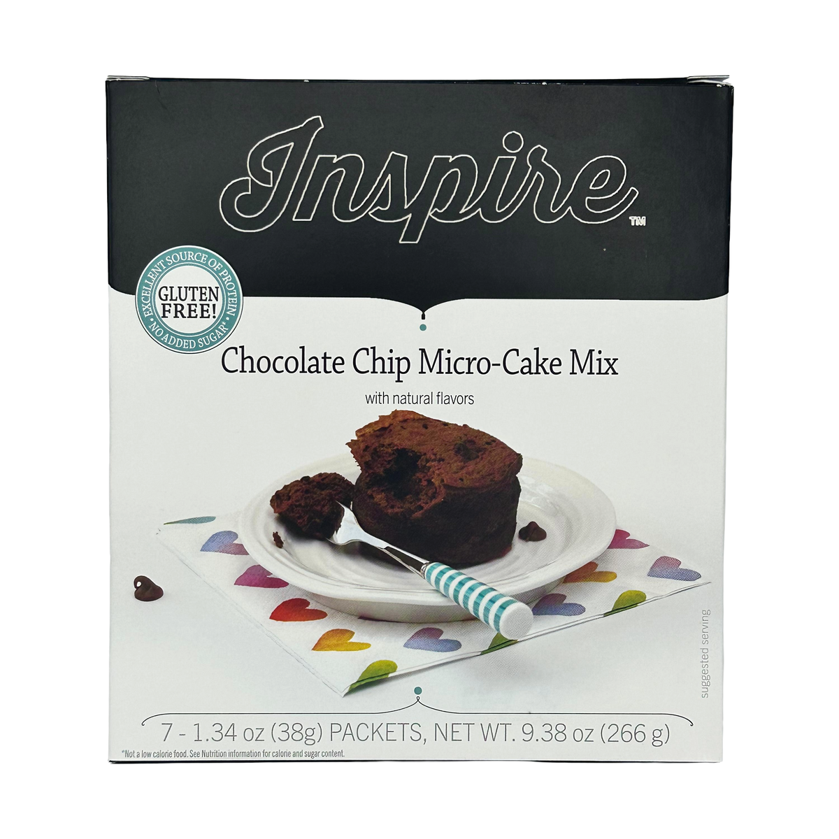 A box of Inspire Chocolate Chip Micro-Cake Mix features a slice of cake on a white plate with a fork, set on a colorful heart-patterned napkin, highlighting its gluten-free and natural flavors.