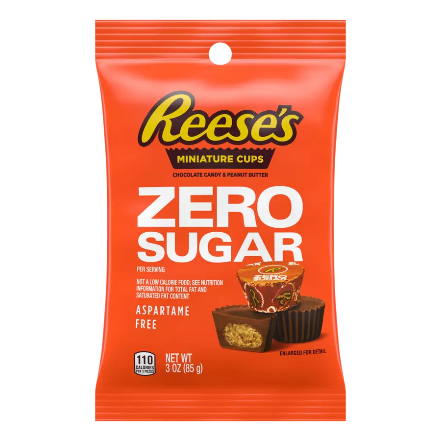 A bright orange packaging features Reese's Miniature Cups labeled "Zero Sugar," showcasing chocolate candy and peanut butter with nutritional information and a note that it's aspartame-free.