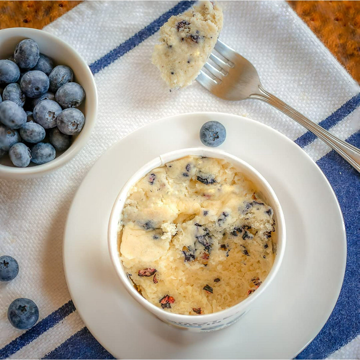 Prepared Bootylicious Blueberry muffin cup with blueberries and fork