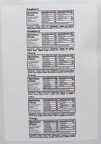 A printed nutrition facts sheet lists information for various fruit flavors including raspberry, strawberry, cherry, lemon, lime, and orange, detailing ingredients and nutritional values per serving.
