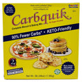 A bright yellow box of Carbquik baking mix features images of a pizza, pancakes, and biscuits, highlighting its low-carb, keto-friendly benefits and nutritional claims.
