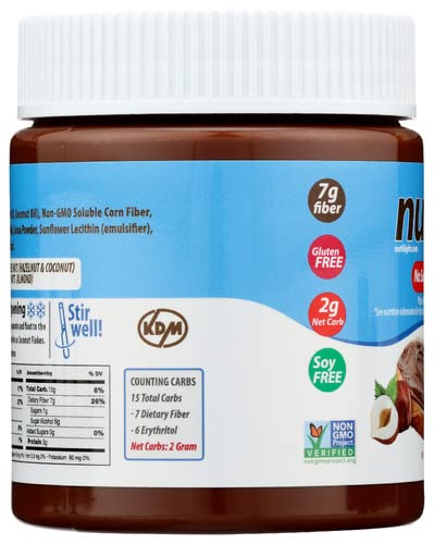 A brown jar of nut butter features a white lid, with labels highlighting nutritional information, including 7g fiber, 2g net carbs, and dietary claims like gluten-free and soy-free.