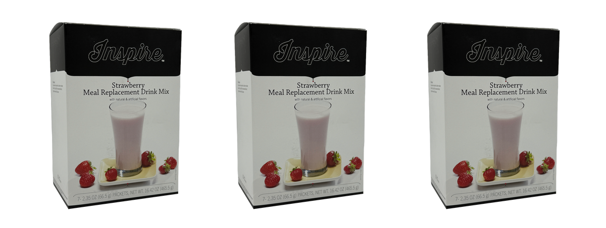 Three boxes of Inspire Strawberry Meal Replacement Drink Mix are displayed side by side, each featuring a glass of pink drink and fresh strawberries on a plate, emphasizing the product's flavor and contents.