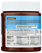 A brown jar labeled with ingredient details, including sustainable palm oil, coconut oil, and hazelnuts, features a warning about refrigeration and a nutrition facts panel on the front.