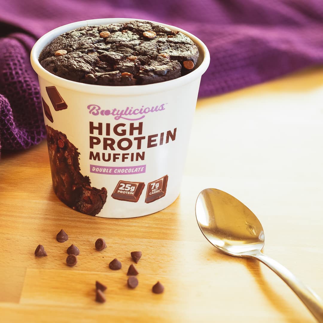 Prepared Bootylicious Double Chocolate muffin in its cup with chocolate chips and spoon