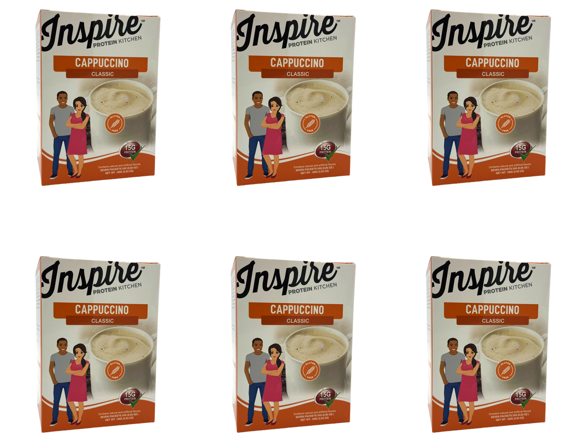 Six boxes of Inspire Protein Kitchen Classic Cappuccino are displayed, each featuring a cup of cappuccino and illustrations of a man and woman, emphasizing the product's protein content.