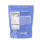 A blue packaging for a gluten-free blueberry muffin mix displays nutrition facts, serving instructions, and a brief story about the Lakanto brand, emphasizing low carbs and natural ingredients.
