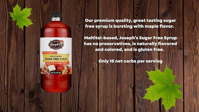 A bottle of Joseph's Sugar Free Maple Syrup is displayed on a wooden surface, surrounded by green leaves, with text highlighting its flavor, ingredients, and nutritional information.