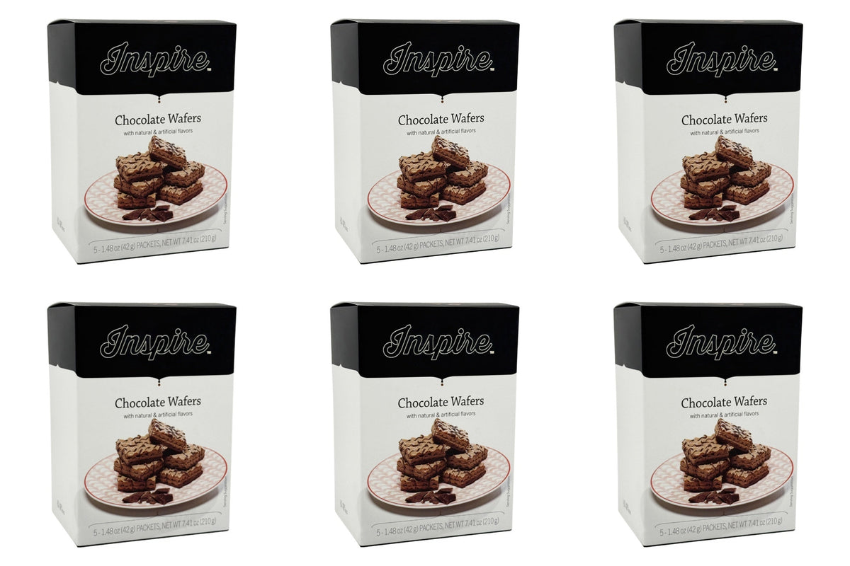 Six boxes of Inspire Chocolate Wafers are arranged in a grid, each featuring a picture of stacked chocolate wafers on a plate, with the product name and description clearly displayed on the front.