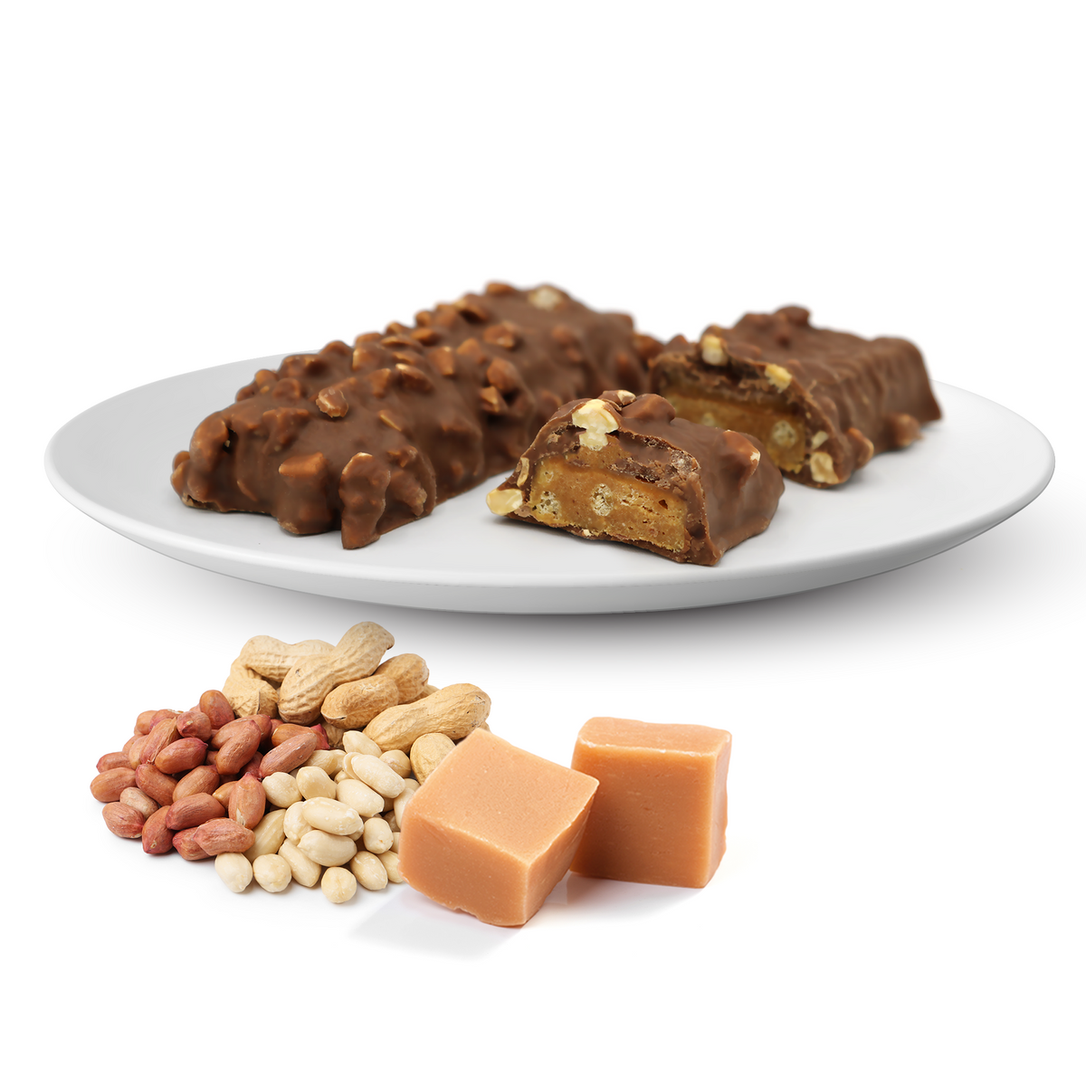 Chocolate-covered snack bars with a crunchy peanut and caramel filling, topped with chopped peanuts, displayed on a white plate alongside assorted peanuts and two pieces of soft caramel.