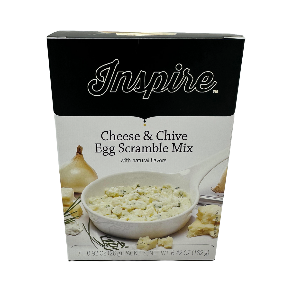 A box of Inspire Cheese & Chive Egg Scramble Mix features a bowl of the mix with a creamy texture, surrounded by chives and an onion, highlighting its natural flavors and packaging details.