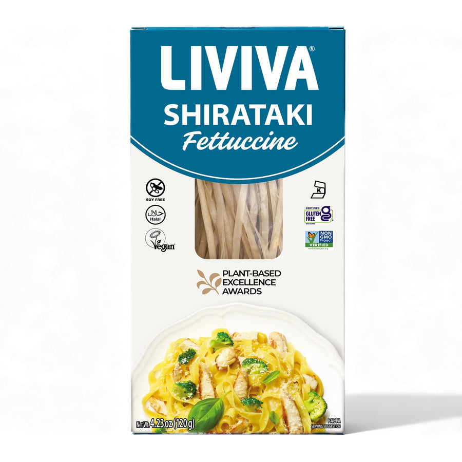 A package of Liviva Shirataki Fettuccine displays the product name prominently, featuring a clear view of the noodles inside and an image of a pasta dish with chicken and vegetables on the front.