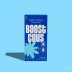 A bright blue box of "Boost Cous" protein-packed couscous features playful graphics, highlighting 18 grams of protein and 6 grams of fiber, set against a matching blue background.