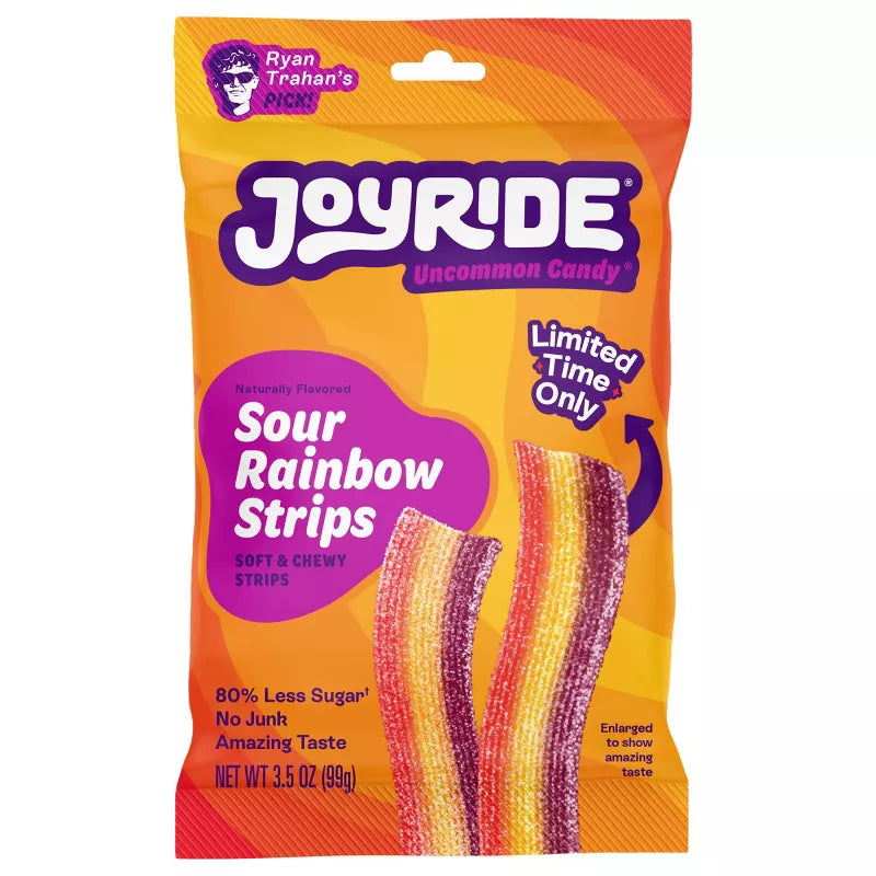A colorful package of Joyride Sour Rainbow Strips candy features vibrant, chewy strips in shades of purple, yellow, and orange, labeled as "Limited Time Only" and highlighting its low sugar content.