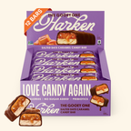A box of Harken's "The Gooey One" salted date caramel candy bars displays 12 individually wrapped bars, with one cut in half to show the gooey filling, set against a purple background.