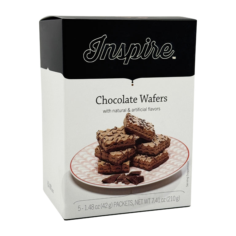 A box of Inspire Chocolate Wafers displays a stack of chocolate wafers on a decorative plate, highlighting the product's name and flavor details on the packaging.