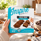 Inspire Rocky Road Protein Bars with chocolate, peanuts and marshmallow flavor. Each gluten-free bar has 13 grams of protein; seven bars per box.