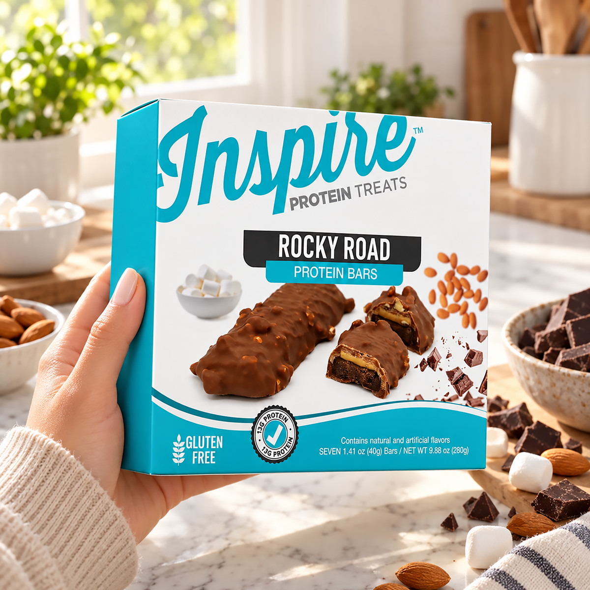 Inspire Rocky Road Protein Bars with chocolate, peanuts and marshmallow flavor. Each gluten-free bar has 13 grams of protein; seven bars per box.