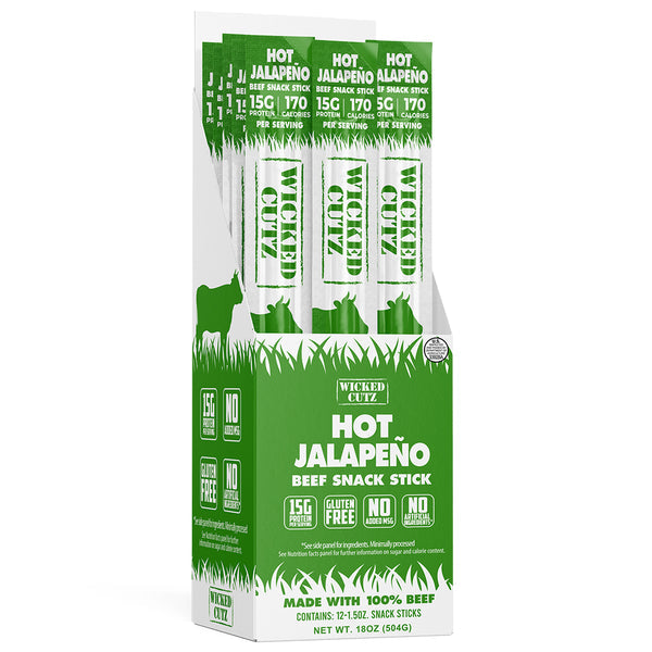 A green and white box displays multiple Hot Jalapeño Beef Snack Sticks, labeled "Wicked Cutz," highlighting nutritional information and featuring a cow graphic on a grassy background.