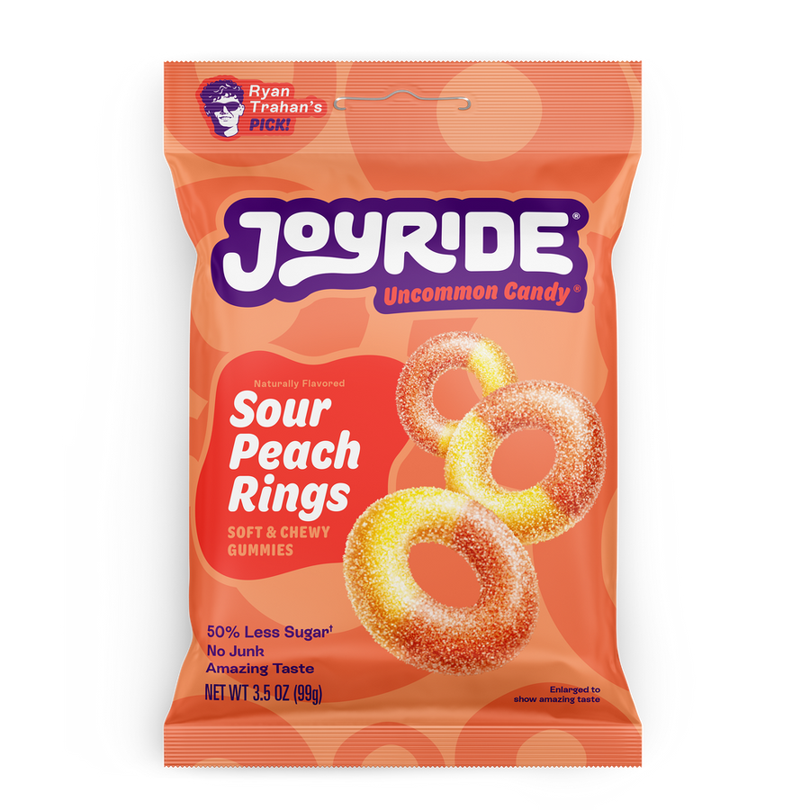 A colorful bag of Joyride Sour Peach Rings candy features soft, chewy gummy rings with a vibrant orange and yellow color, labeled as having 50% less sugar and an amazing taste.