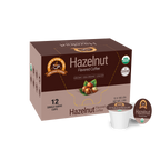 A brown box of organic hazelnut flavored coffee with a logo and information about its low acidity, containing 12 single-serve cups, is displayed against a plain background.