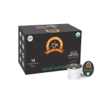 A black box of Alex's Low Acid Organic Coffee, featuring 12 single-serve decaf cups, displays the logo and labels indicating it's USDA Organic and Kosher, with a medium dark roast designation.