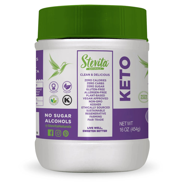 A white container of Stevita Naturals Keto sweetener with a green lid displays labels highlighting its zero calories, zero carbs, and various dietary certifications, set against a plain background.