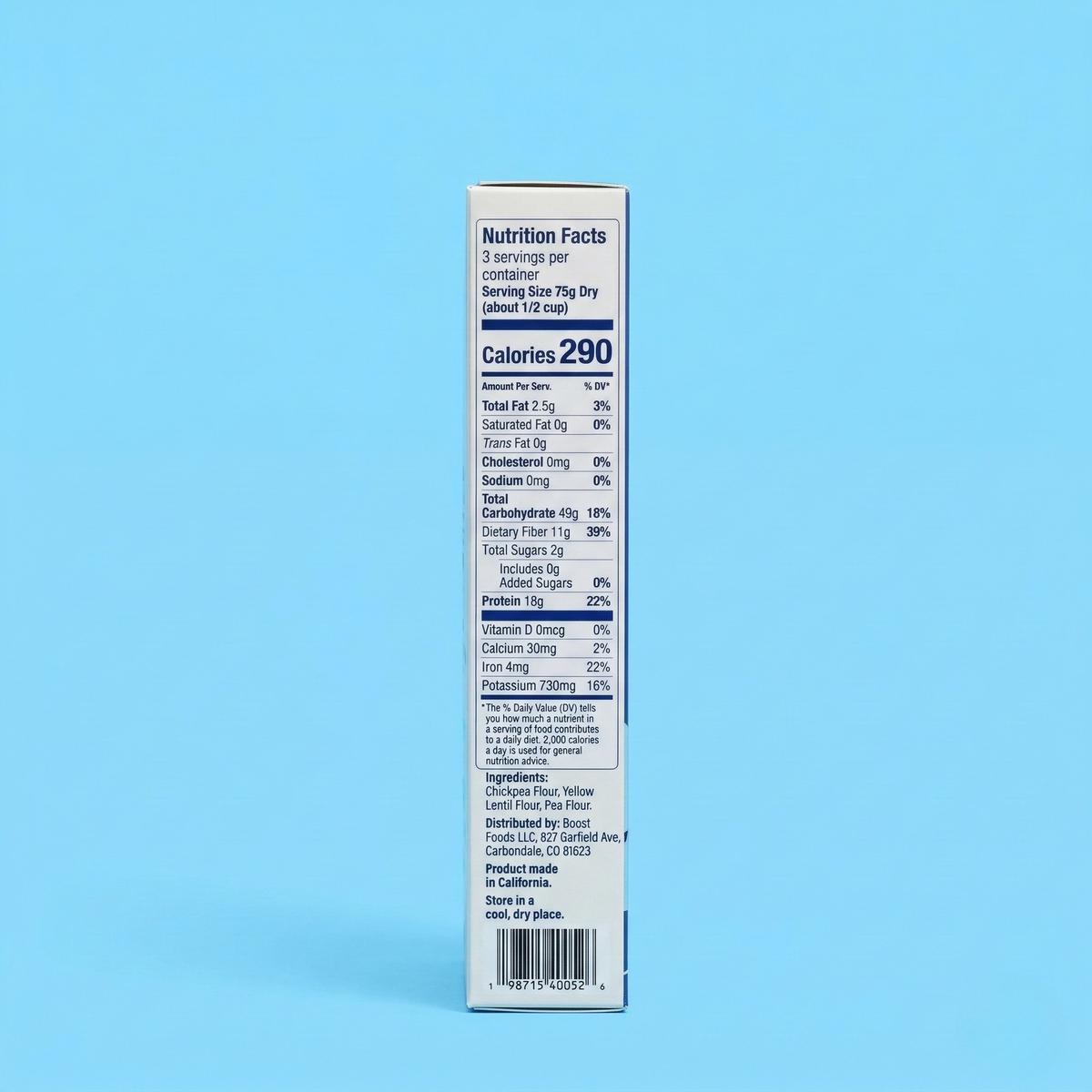 A nutrition facts label on a product box displays serving size, calories, and nutrient information against a light blue background.