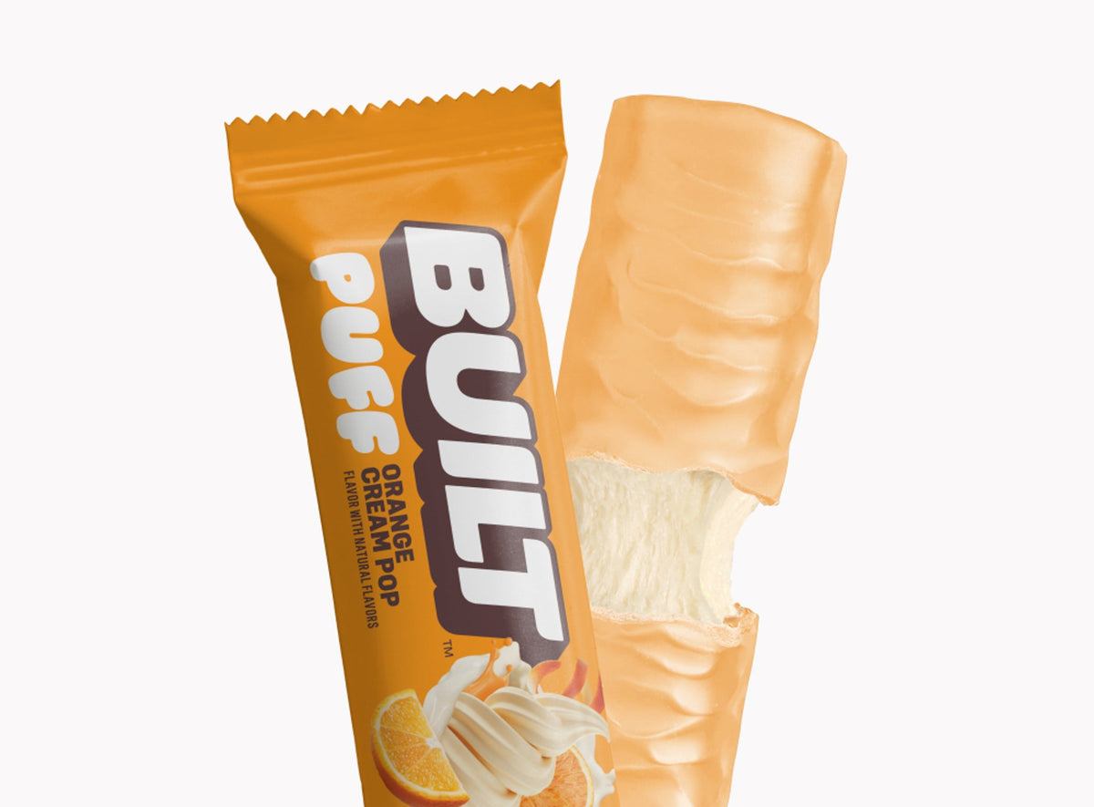 Front package of Built Bar Protein Puffs, Orange Cream Pop / One Bar