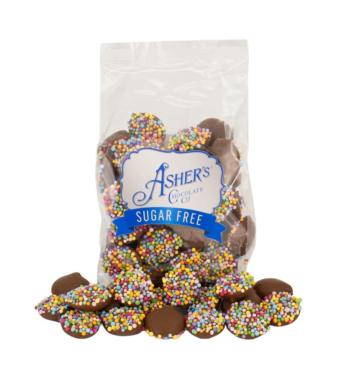 A clear bag of Asher's Sugar Free chocolate candies is filled with colorful, round sprinkles, with some candies spilling out onto a white surface.