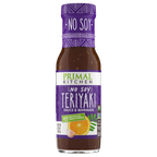 A bottle of Primal Kitchen No Soy Teriyaki Sauce and Marinade features a purple label with white text, highlighting its soy-free and no artificial sweeteners attributes, alongside an orange and garlic illustration.
