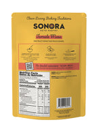 A yellow packaging for Sonora Keto Pantry Tamale Masa features cooking instructions in English and Spanish, along with a nutrition facts panel and a QR code for detailed instructions.