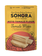 A bright yellow package of Sonora Keto Tamale Flour features a graphic of tamales and highlights its low-carb content, emphasizing authentic flavor and ease of use for baking.
