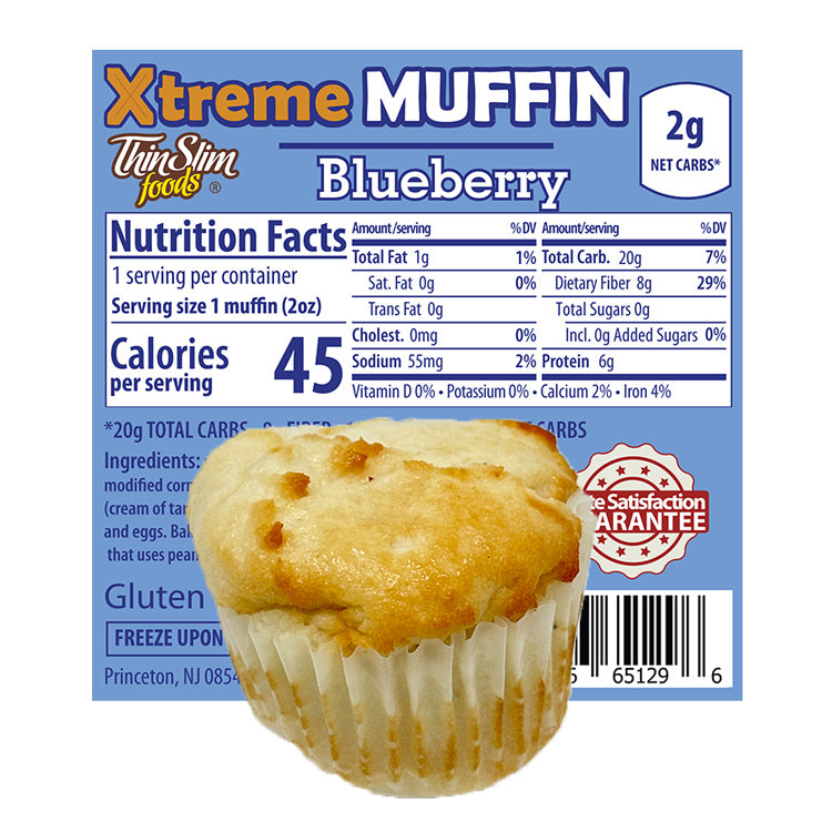 ThinSlim Foods Xtreme Muffins Blueberry label with Nutrition Facts behind the product on a white background.