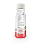 A bottle of protein drink is displayed, showing the back label with nutrition facts, ingredients, and serving information, featuring a red and green design.