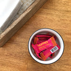 Numa Strawberries 'n Creme wrapped taffies in a bowl