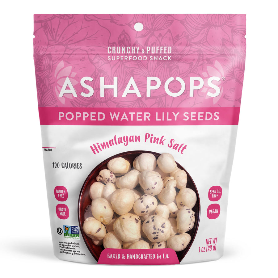 A colorful package of Asha Pops features popped water lily seeds with Himalayan pink salt, highlighting its gluten-free, vegan, and handcrafted qualities, along with a calorie count of 120.