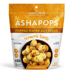 A bag of Asha Pops Popped Water Lily Seeds in Turmeric Garlic flavor, featuring a bowl of crunchy snacks, labeled as gluten-free, vegan, and handcrafted, with a bright orange and white design.