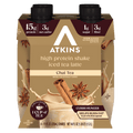 A four-pack of Atkins high protein iced tea latte shakes in chai tea flavor, featuring nutritional information and images of cinnamon sticks and star anise on the packaging.