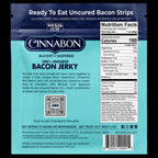 A blue packaging for "100% Uncured Bacon Jerky" features the Cinnabon logo, highlights its gluten-free and no added MSG qualities, and includes nutrition facts and a QR code for rewards.