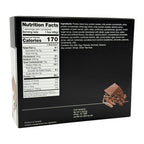 A nutrition facts label on a protein bar package displays serving size, calories, and ingredients, with an image of chocolate pieces and cocoa beans in the lower right corner.
